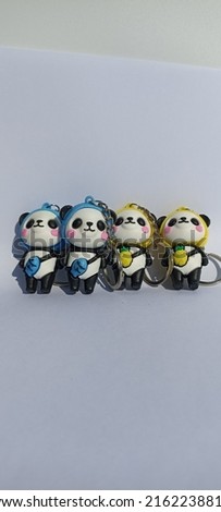 Doll character key chain, made of colorful rubber material, harmless.