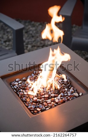A gas patio backyard fireplace, or fire pit.