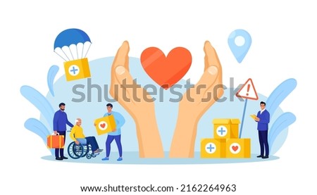 Humanitarian aid. Social worker distributing food, medical supplies to needy people. Volunteering, donation, humanitarian relief. Volunteers giving help boxes to refugees Government assistance to poor Royalty-Free Stock Photo #2162264963