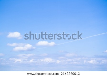 Cumulus clouds. White clouds on a blue background. Summer sky.
