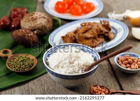 Rice and Sticky Rice with Pork Chicken Meat Soy Sauce Stir Fry, Mushroom, Peanuts, and Salted Egg Yolk. Ingredient Making Bak Chang or Zongzi for Duanwu Dragon Boat Chinese Festival 