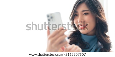 asian female gesture funny video calling to her friend with cheerful happiness conversation,asia woman using smartphone conversation while face expression hand gesture sign alright ok on sofa