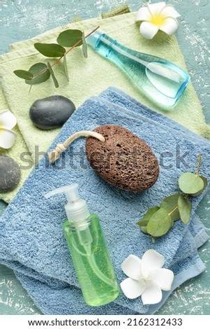 Bath supplies for foot massage on green background