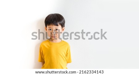 Cyberbullying Low self esteem.Asian kid boy child feeling sad.Autism kid with bad comments and hate speech.Mental health.Bully, Anxiety health, Social media harassment.Emotional Tantrum and Angry boy. Royalty-Free Stock Photo #2162334143