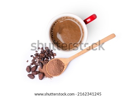 Cocoa drink and cocoa powder with cacao beans in wooden spoon isolated on white background. Top view. Flat lay. 