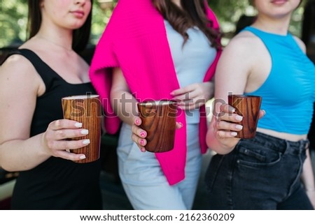 Girls holding coffee in their hands. Delicious cappuccino in the hands of a girl. Coffee and cappuccino in hands. Good morning. Delicious coffee.