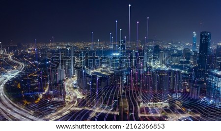 Smart city with particle glowing light connection design, big data connection technology concept. Royalty-Free Stock Photo #2162366853