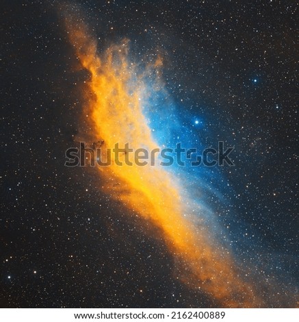 California Nebula imaged through Telescope Live's remote robotic telescopes in narrowband filters (SHO), blue and yellow nebulosity in hubble palette of a big space object