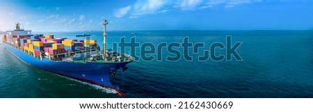 Aerial side view of cargo ship carrying container and running for export  goods  from  cargo yard port to custom ocean concept technology transportation , customs clearance.