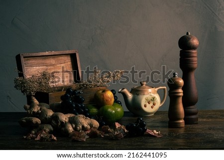 Still Life Photography with fruits and vegetables and a gray wall