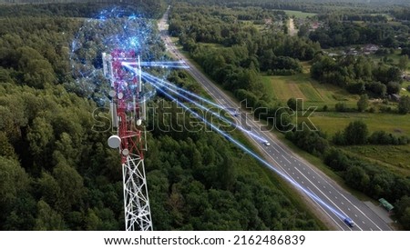 Aerial view of a telecommunications antenna transmitting signals and collecting information about electronic smart self-driving cars. Concept:Car Scan, GPS Tracking, Smart Roads, IoT, Traffic Control Royalty-Free Stock Photo #2162486839