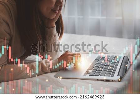 Crypto trader investor analyst looking at screen analyzing financial graph data on laptop in bed. Cryptocurrency, Stocks, Investing, Business finance technology, digital marketing, E-business concept