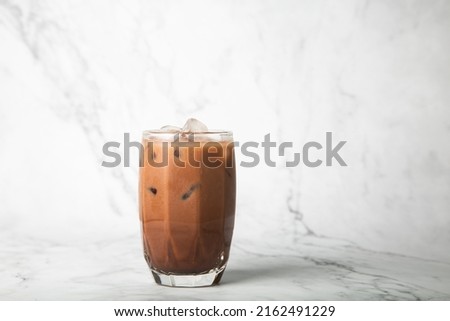 Iced cocoa in clear glass on marble, copy space for your text Royalty-Free Stock Photo #2162491229