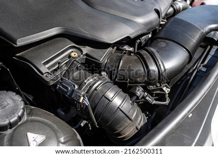Plastic air intake pipes for a modern 2.2 liter diesel engine with a capacity of 220 horsepower. Royalty-Free Stock Photo #2162500311