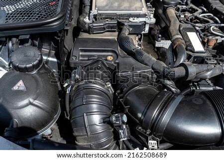 Plastic air intake pipes for a modern 2.2 liter diesel engine with a capacity of 220 horsepower. Royalty-Free Stock Photo #2162508689