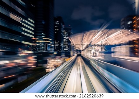 Long exposure motion blur from Yurikamome Monorail line in Tokyo, Japan. Abstract for Digital, Metaverse Technology, Futuristic Transportation, Computer Network, and Communication concept.