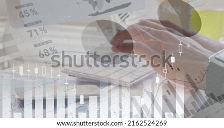 Digital composite of the man typing on his keyboard against the image of financial data in an office