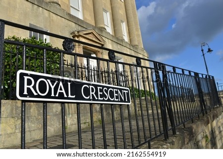 View of a street sign outside terraced townhouses on the landmark Georgian era Royal Crescent in the historic city of Bath in Somerset England