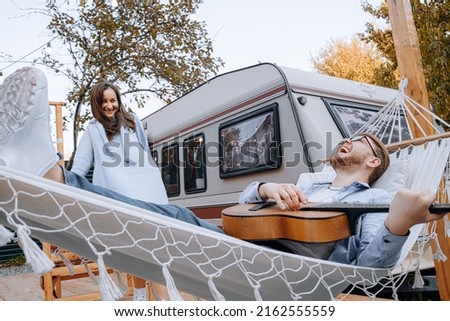 couple in love living in trailer on camping and have fun and happy