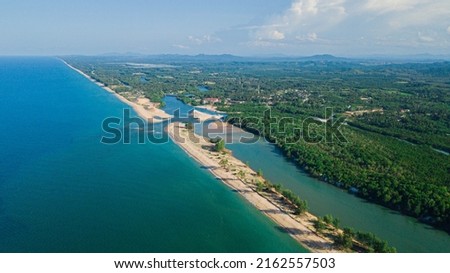 Aerial drone view of coastline scenery during daylight in Pantai Angin Berbisik, Marang, Terengganu, Malaysia