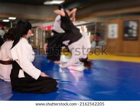 Aikidoka uses the technique joint lockon the opponent during the training of aikido Royalty-Free Stock Photo #2162562205