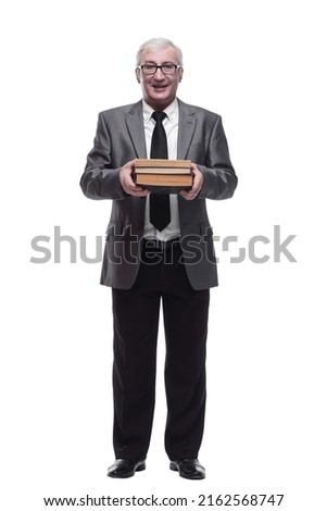 smiling business man with a stack of books.