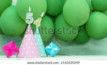 Birthday number 54, a beautiful card with balloons and numbers from candles, a happy birthday background for a girl.
