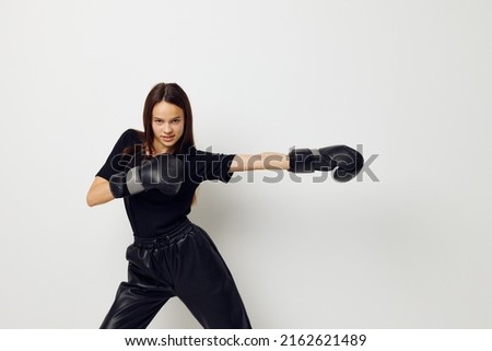 athletic woman boxing black gloves posing sports boxing punch light background