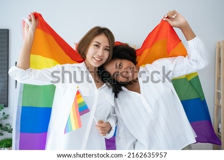 Diversity African American and Asian Married couples Lesbian LGBTQ. Married homosexual show Diamond ring.Sexual equality,LGBT Pride month,Parade celebrations concept.Family of happiness smiling. Royalty-Free Stock Photo #2162635957
