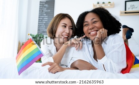 Diversity African American and Asian Married couples Lesbian LGBTQ. Married homosexual show Diamond ring.Sexual equality,LGBT Pride month,Parade celebrations concept.Family of happiness smiling. Royalty-Free Stock Photo #2162635963