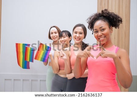 Diversity African American and Asian Married couples Lesbian LGBTQ. Married homosexual show Diamond ring.Sexual equality,LGBT Pride month,Parade celebrations concept.Family of happiness smiling. Royalty-Free Stock Photo #2162636137