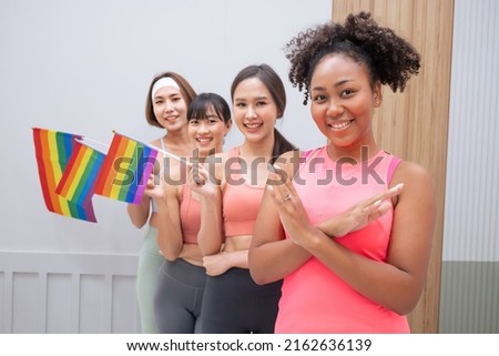 Diversity African American and Asian Married couples Lesbian LGBTQ. Married homosexual show Diamond ring.Sexual equality,LGBT Pride month,Parade celebrations concept.Family of happiness smiling. Royalty-Free Stock Photo #2162636139