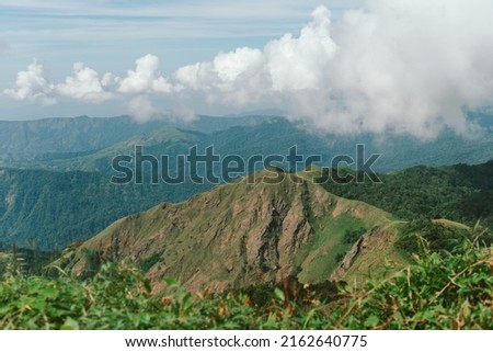 Nature of life, a natural elevation of the earth's surface rising more or less abruptly to a summit, and attaining an altitude greater than that of a hill Royalty-Free Stock Photo #2162640775