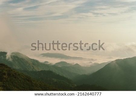 Nature of life, a natural elevation of the earth's surface rising more or less abruptly to a summit, and attaining an altitude greater than that of a hill Royalty-Free Stock Photo #2162640777