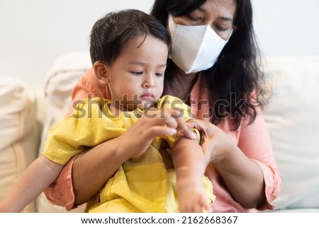 Monkeypox infection pandemic.African kid child hand symptom pox on monkeypox infection.Monkeypox is a rare disease infection with virus.kid Health.infection in South America.Mosquito bite.dengue fever Royalty-Free Stock Photo #2162668367
