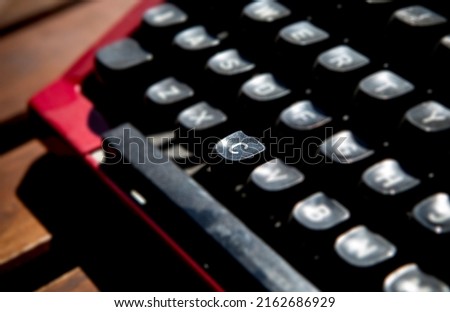 1970s dusty typewriter. Selective focus on key C