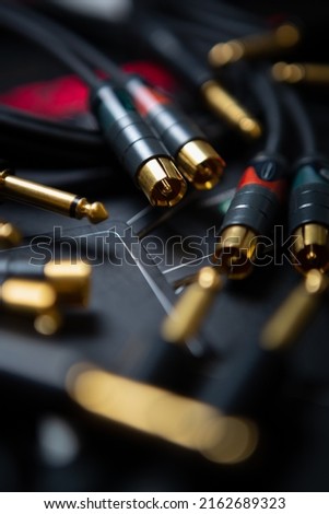 Professional audio cables for sound recording studio. Connector musical equipment with hi fi cable connectors. Curated collection of royalty free music images and photos for poster design template