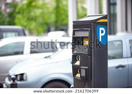 Parking meter on city street, space for text. Modern device Royalty-Free Stock Photo #2162706399