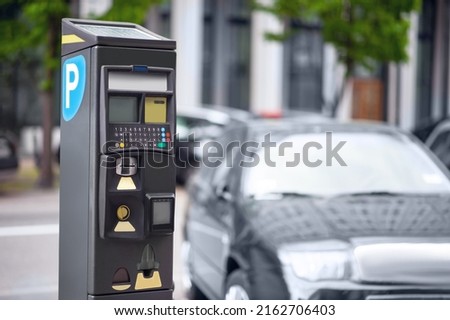 Parking meter on city street, space for text. Modern device Royalty-Free Stock Photo #2162706403