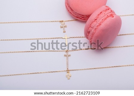 Cross necklaces lined up on a flat background. Image for e-commerce, online selling, social media, jewelry sale.