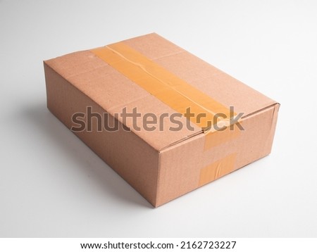 Close up of an close cardboard packaging box top view isolated on a white background