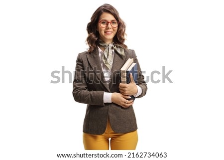 Young woman with glasses holding books and smiling isolated on white background