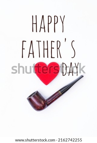 Happy Father's day message with antique wooden pipe with red heart on white background, Father's day card concept