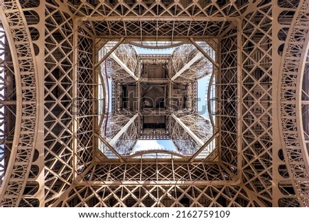 View of the Eiffel tower seen from below in Paris, France. Architecture and monuments of Paris. Paris postcard Royalty-Free Stock Photo #2162759109