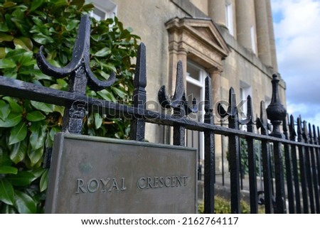 View of a street sign outside terraced town houses on the landmark Georgian era Royal Crescent in the historic city of Bath in Somerset England
