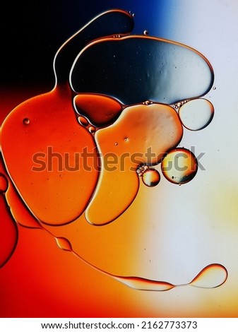 Unique and original Macro Shooting of oildrops in water with different colored bachgrounds