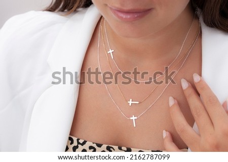 Silver necklace on live model. Image for e-commerce, online selling, social media, jewelry sale. Royalty-Free Stock Photo #2162787099