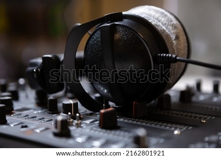 DJ headphones and sound mixer. Professional audio equipment for disc jockey. Curated collection of royalty free dj music images and photos for poster design template on shutter stock 