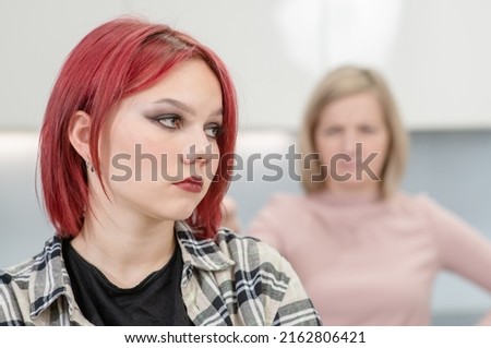 Family conflict. Unhappy mother and resentful daughter are offended at each other Royalty-Free Stock Photo #2162806421