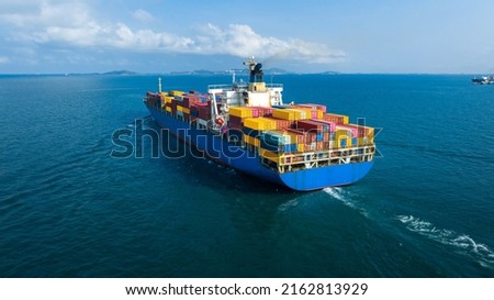 Stern of large cargo ship import export container box on the ocean sea on blue sky back ground concept transportation logistic and service to customer and supply change Royalty-Free Stock Photo #2162813929